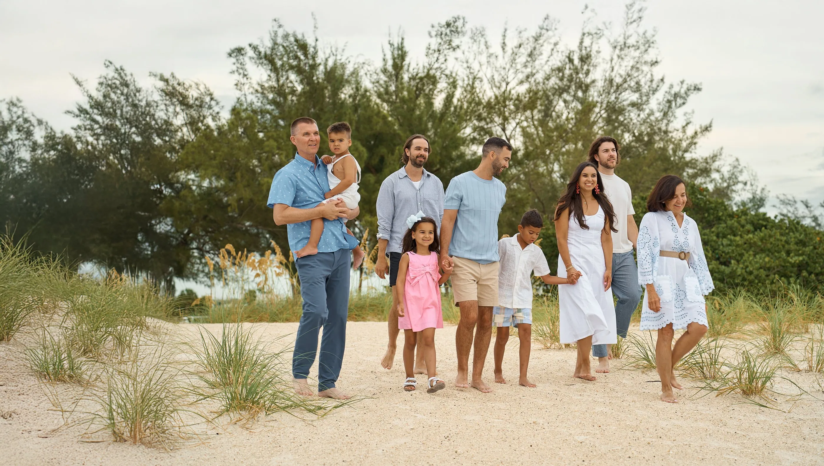 Ten people walking together through the sea grape